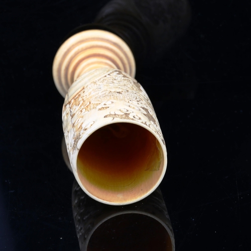 1085 - A Japanese ivory goblet circa 1900, the bowl relief carved with sea dragons, and ring turned base wi... 