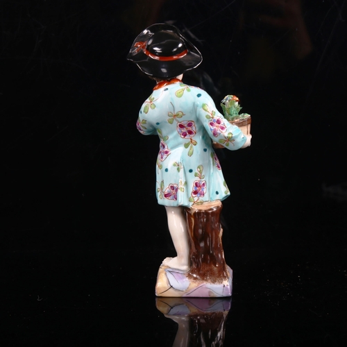 1034 - KPM porcelain figure of a boy holding a pot plant, height 14.5cm