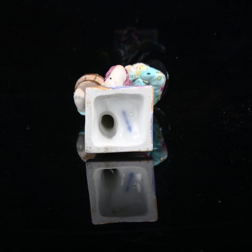 1034 - KPM porcelain figure of a boy holding a pot plant, height 14.5cm