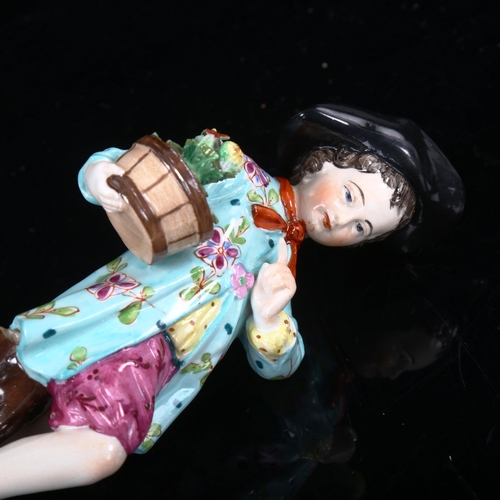 1034 - KPM porcelain figure of a boy holding a pot plant, height 14.5cm