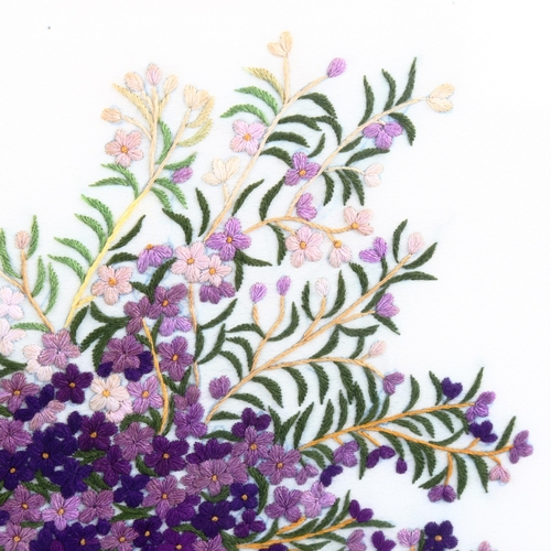 1026 - A silk embroidered picture, depicting lilac flowers in an urn, framed, overall frame dimensions 58cm... 