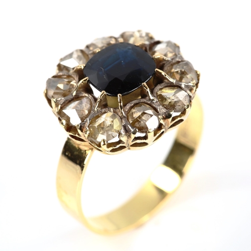 202 - An 18ct gold sapphire and diamond cluster ring, set with oval cushion-cut sapphire and rose-cut diam... 