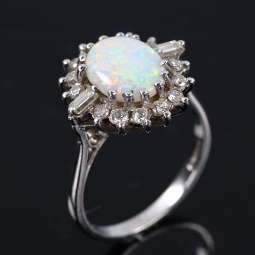 209 - A late 20th century 18ct white gold opal and diamond cluster ring, set with oval cabochon opal and b... 