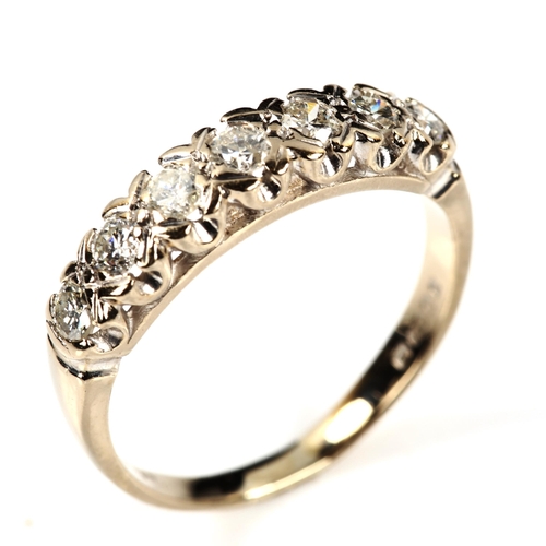 212 - An 18ct white gold seven stone diamond half eternity ring, set with modern round brilliant-cut diamo... 