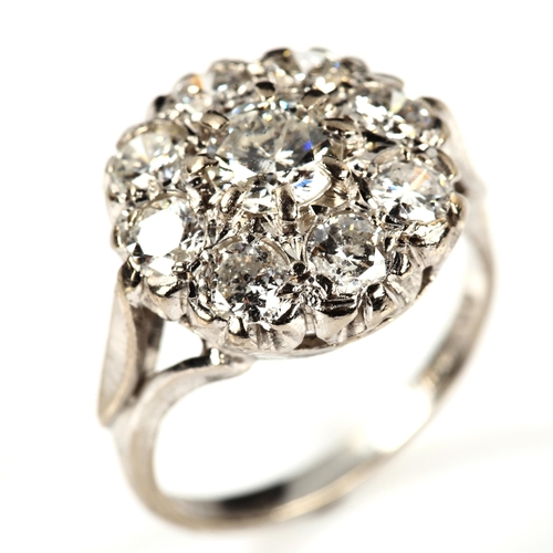 213 - An 18ct white gold diamond cluster ring, set with modern round brilliant-cut diamonds, total diamond... 