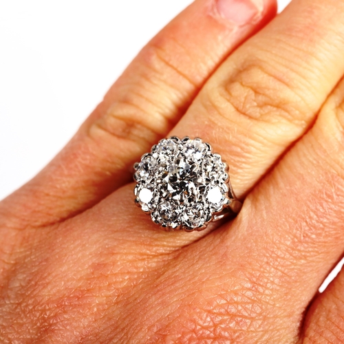 213 - An 18ct white gold diamond cluster ring, set with modern round brilliant-cut diamonds, total diamond... 