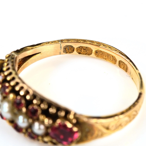 215 - A Victorian 15ct gold ruby and pearl half hoop ring, foliate engraved shoulders with closed-back set... 