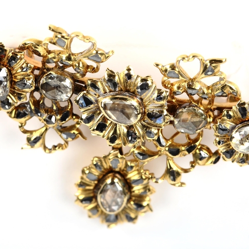 217 - An Indian unmarked gold rose-cut diamond floral brooch, with pendant drop, brooch width 53.6mm, heig... 