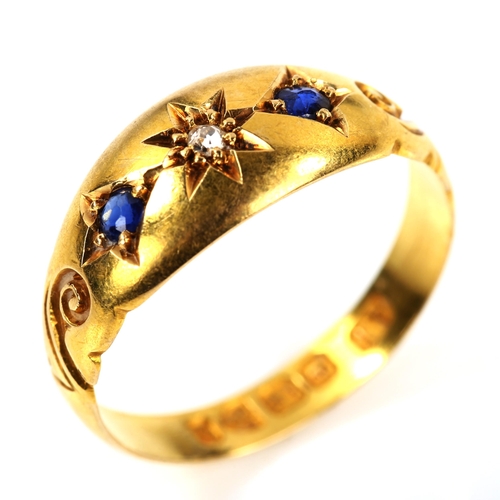 219 - A Victorian 18ct gold three stone sapphire and diamond ring, set with old-cut diamond and oval-cut s... 