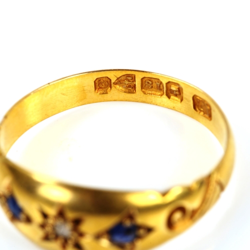 219 - A Victorian 18ct gold three stone sapphire and diamond ring, set with old-cut diamond and oval-cut s... 