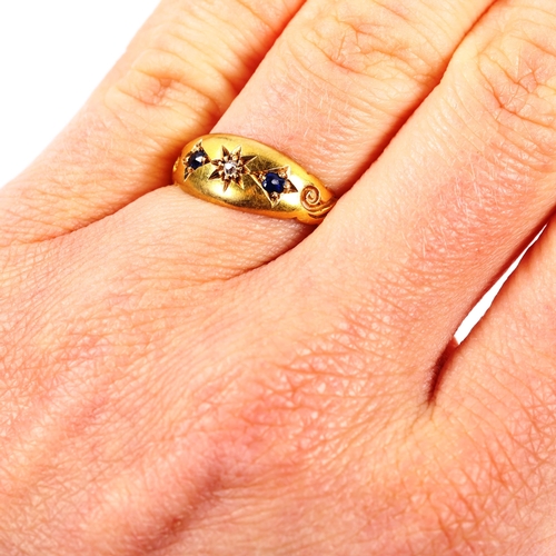 219 - A Victorian 18ct gold three stone sapphire and diamond ring, set with old-cut diamond and oval-cut s... 