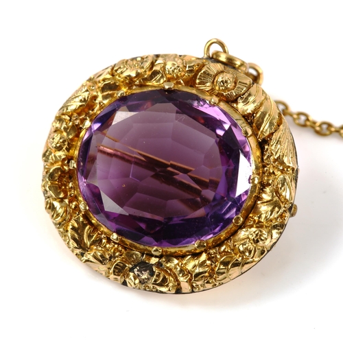 225 - A Victorian unmarked gold amethyst brooch, cast floral surround, brooch length 23.5mm, 7.2g