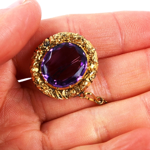 225 - A Victorian unmarked gold amethyst brooch, cast floral surround, brooch length 23.5mm, 7.2g