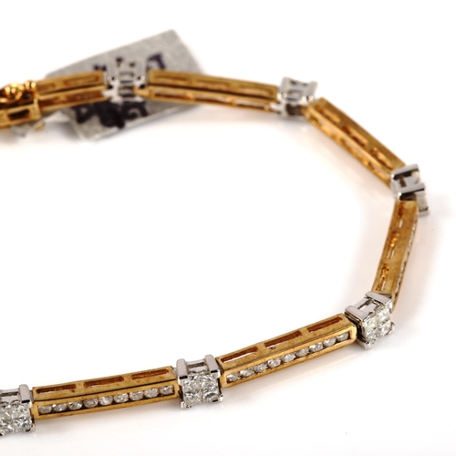 228 - A modern 9ct gold diamond line bracelet, set with Princess and modern round brilliant-cut diamonds, ... 