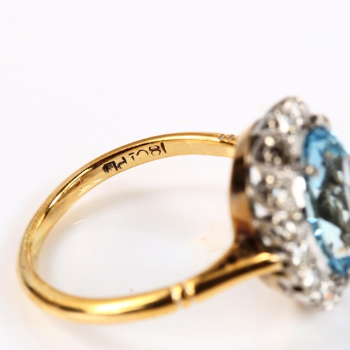 229 - An 18ct gold aquamarine and diamond oval cluster ring, set with oval mixed-cut aqua and single-cut d... 