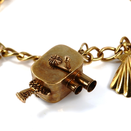 230 - A 9ct gold curb link charm bracelet, with various 9ct charms, including movie camera, bracelet lengt... 