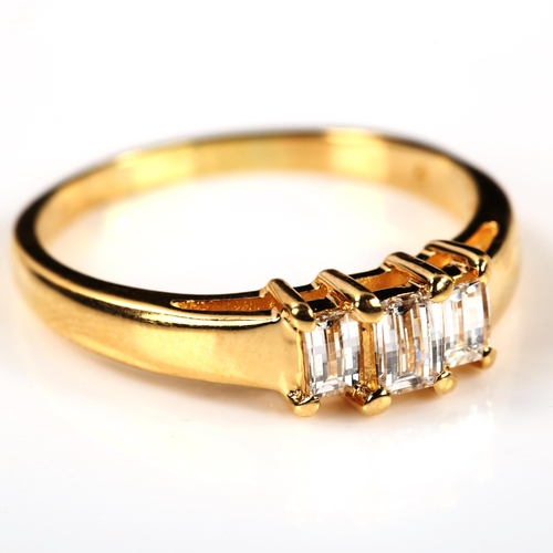 238 - A modern 18ct gold three stone diamond ring, set with rectangular barrel-cut diamonds, total diamond... 