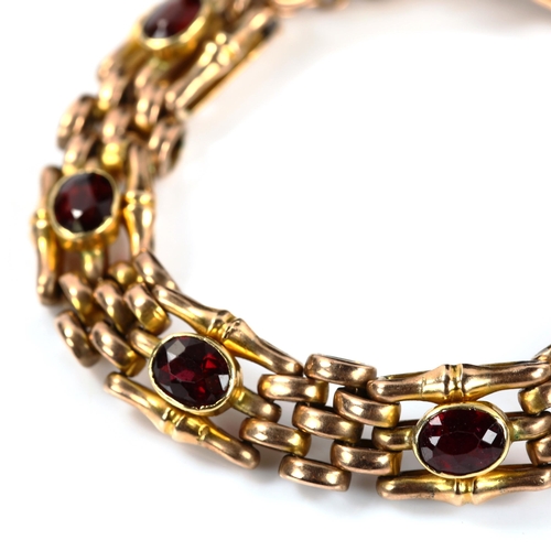 243 - A 9ct rose gold garnet gatelink bracelet, length 16cm, 26.2g