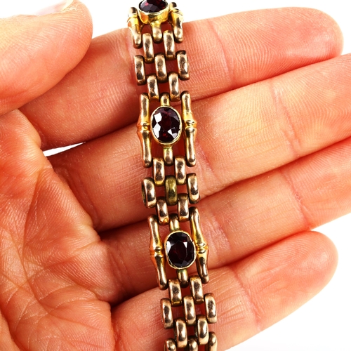 243 - A 9ct rose gold garnet gatelink bracelet, length 16cm, 26.2g