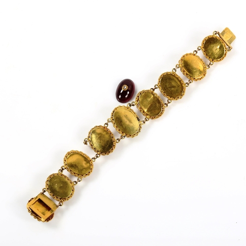 248 - A Georgian garnet and diamond panel bracelet, unmarked yellow metal settings with oval cabochon garn... 