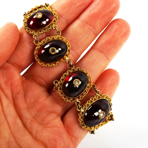 248 - A Georgian garnet and diamond panel bracelet, unmarked yellow metal settings with oval cabochon garn... 