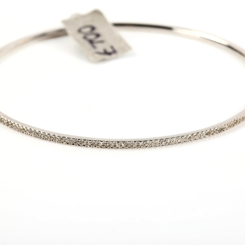 257 - A modern 9ct white gold diamond slave bangle, set with single-cut diamonds, total diamond content ap... 