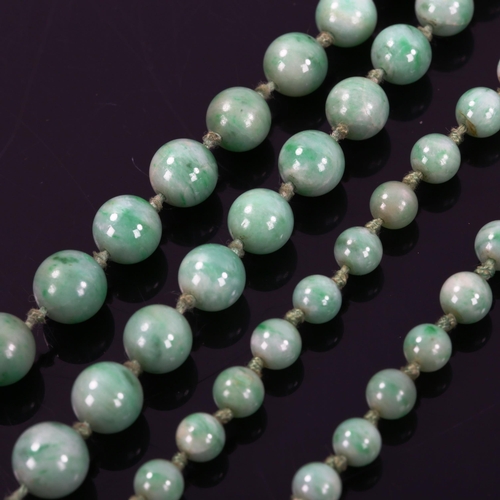 261 - A single-strand graduated jade bead necklace, individually knotted, bead diameters 8.7mm - 4.5mm, ne... 