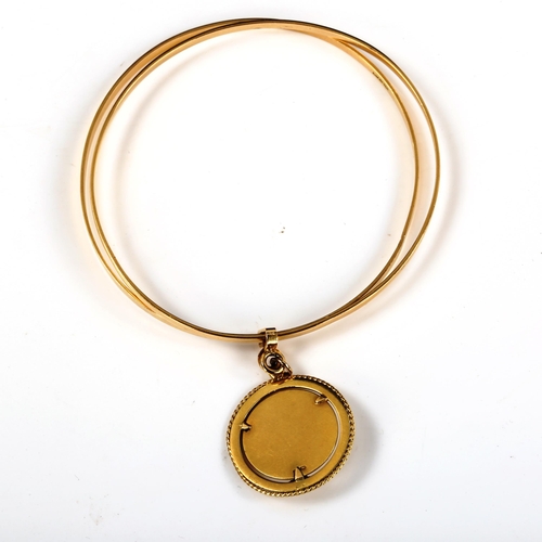 263 - A Middle Eastern 18ct gold double slave bangle, with 18ct enamel urn charm, bangle internal diameter... 