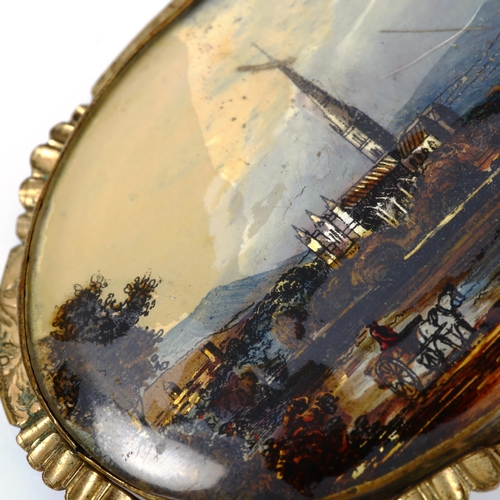 264 - A 19th century hand painted butterfly wing landscape brooch, gilt-metal frame, brooch length 61.3mm,... 