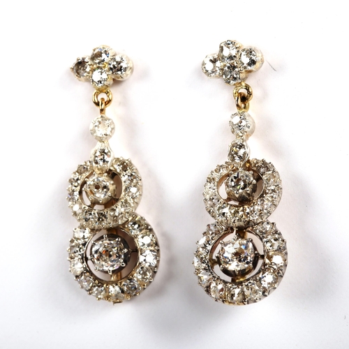 271 - A fine pair of diamond target drop earrings, unmarked gold and silver settings with old-cut diamonds... 