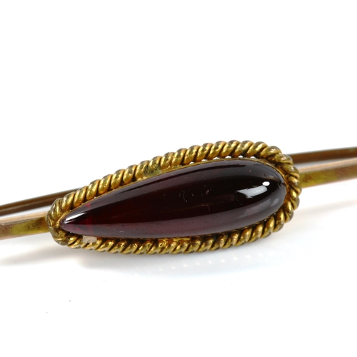 273 - A 19th century cabochon garnet bar brooch, unmarked gold settings, brooch length 65.4mm, 5.8g