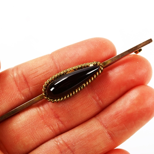 273 - A 19th century cabochon garnet bar brooch, unmarked gold settings, brooch length 65.4mm, 5.8g