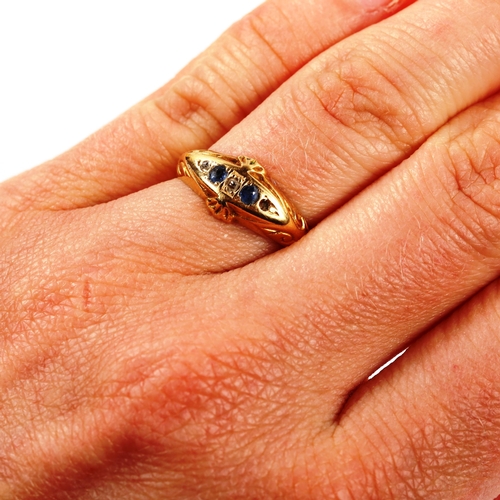 275 - An early 20th century 18ct gold graduated five stone sapphire and diamond half hoop ring, hallmarks ... 