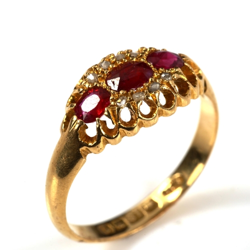 283 - An early 20th century 18ct gold ruby and diamond cluster ring, set with oval mixed-cut ruby and rose... 