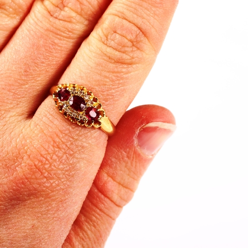 283 - An early 20th century 18ct gold ruby and diamond cluster ring, set with oval mixed-cut ruby and rose... 