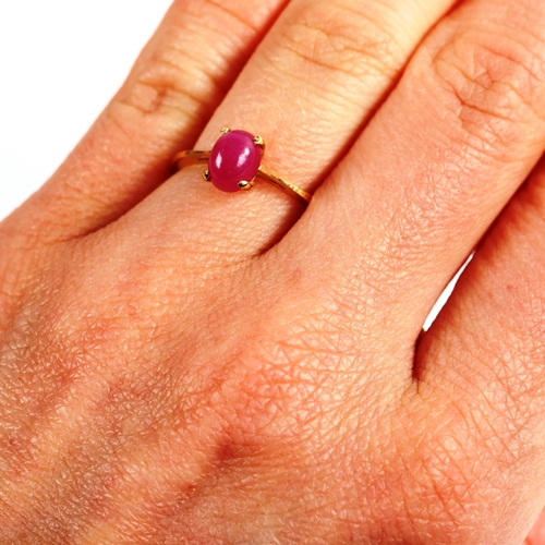 291 - A modern 18ct gold cabochon ruby dress ring, ruby measures: 7.00mm x 5.42mm x 4.20mm, size N, 2.3g