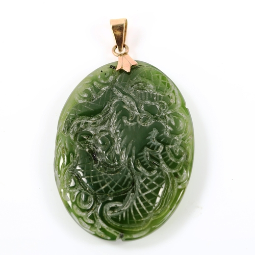 305 - A 14ct gold-mounted jade pendant, carved bird and dragon decoration, pendant height 50.3mm, 10.6g