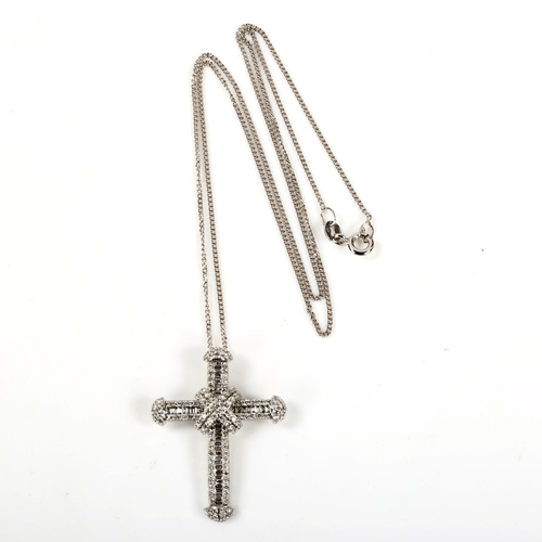 308 - A modern 9ct white gold diamond cross pendant necklace, set with baguette and modern round brilliant... 