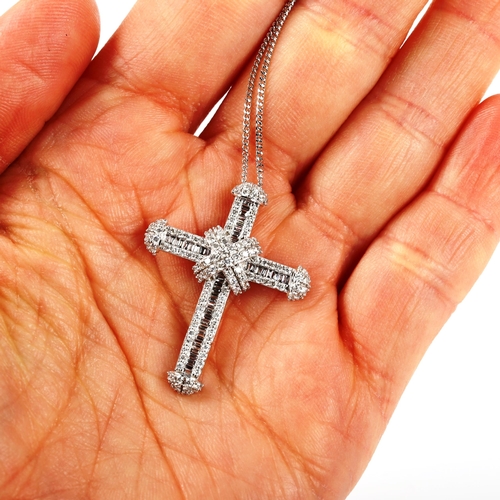 308 - A modern 9ct white gold diamond cross pendant necklace, set with baguette and modern round brilliant... 