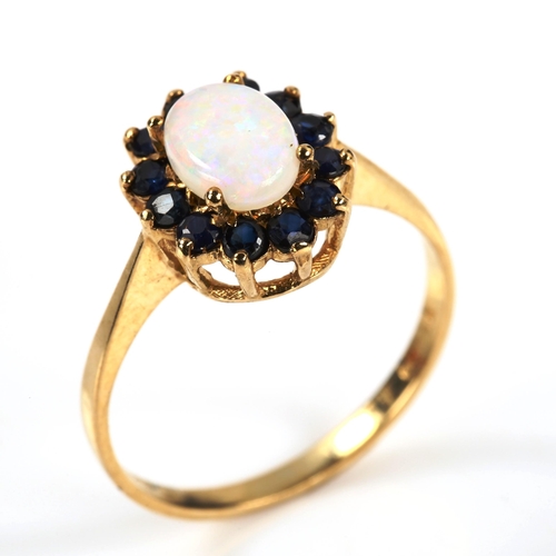 312 - A 9ct gold opal and sapphire oval cluster ring, set with oval cabochon opal and round-cut sapphire, ... 