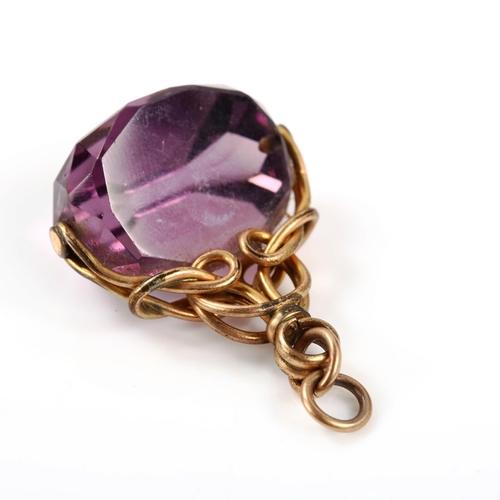 315 - A faceted amethyst swivel fob seal, on gold plated frame, fob height 32.2mm, 11.3g