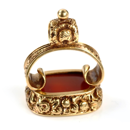 317 - A large 19th century carnelian seal fob pendant, intaglio carved with coronet and banner with motto ... 