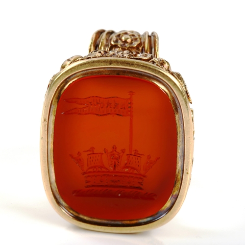 317 - A large 19th century carnelian seal fob pendant, intaglio carved with coronet and banner with motto ... 