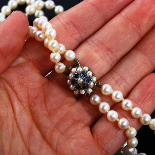 318 - A late 20th century double-strand pearl necklace, with 9ct gold sapphire and pearl clasp, necklace l... 