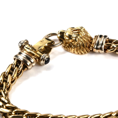 320 - A 9ct gold lion-head bracelet, clasp set with cabochon blue stones, bracelet length 18cm, 19.8g