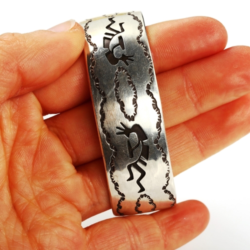 322 - A stylised sterling silver cuff bangle, maker's marks JAC, Native American depicting Kokopelli - fer... 