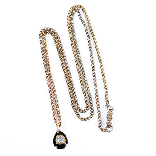 328 - FABERGE - a Russian 14ct gold diamond and black enamel egg pendant necklace, set with old-cut diamon... 