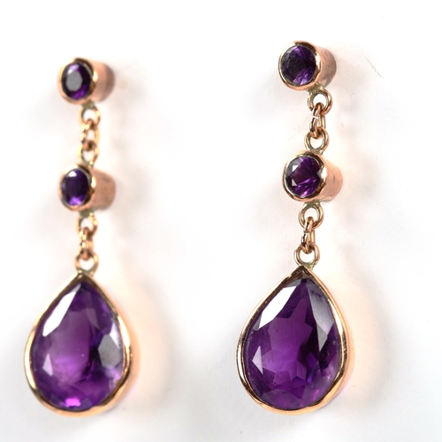 331 - A pair of 9ct rose gold amethyst drop earrings, set with pear and round-cut amethysts, earring heigh... 