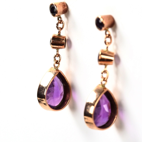 331 - A pair of 9ct rose gold amethyst drop earrings, set with pear and round-cut amethysts, earring heigh... 