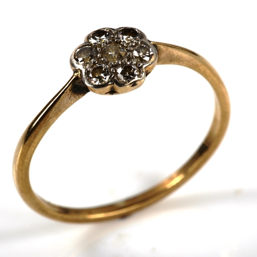 338 - An unmarked gold diamond flowerhead cluster ring, set with old and round brilliant-cut diamonds, tot... 